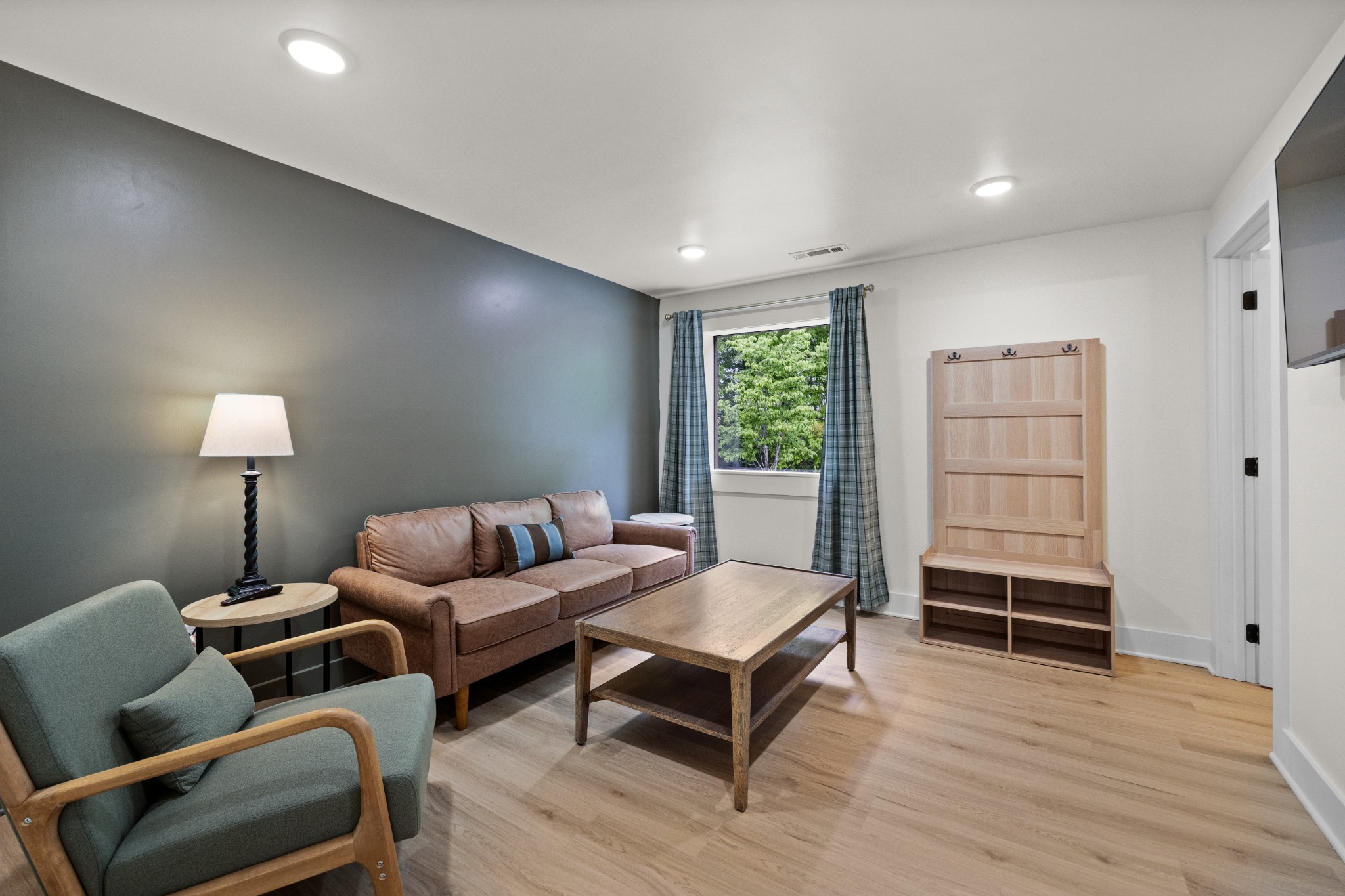 1249 Gulf Road Spencer, TN 38585 - Photo 32 of 98 a living room with furniture a lamp and a window