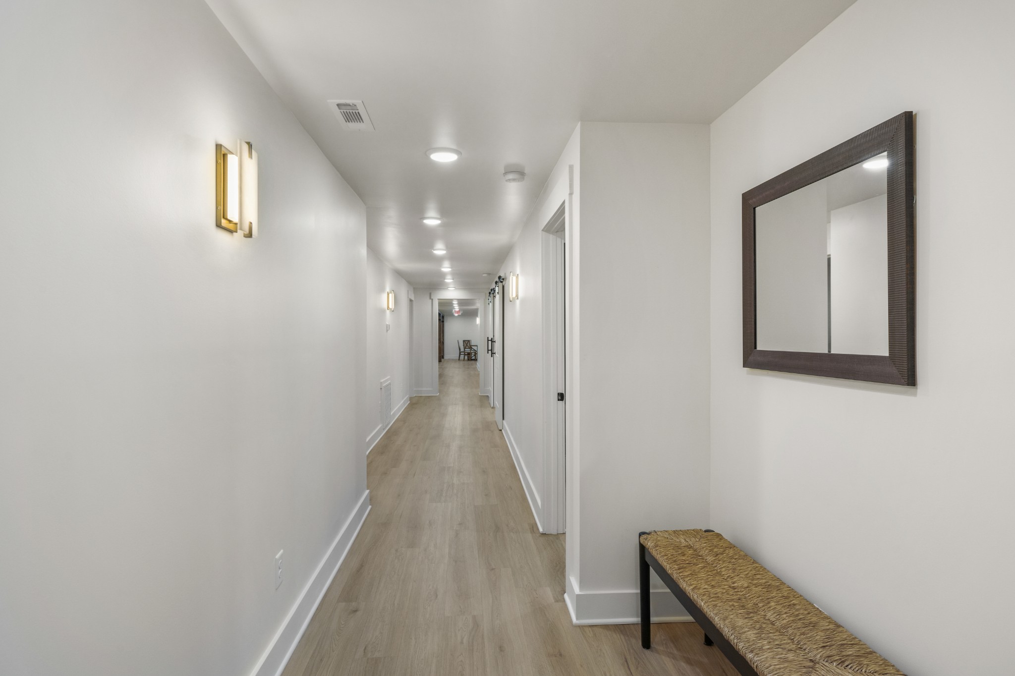1249 Gulf Road Spencer, TN 38585 - Photo 36 of 98 a view of a hallway with wooden floor and a bathroom