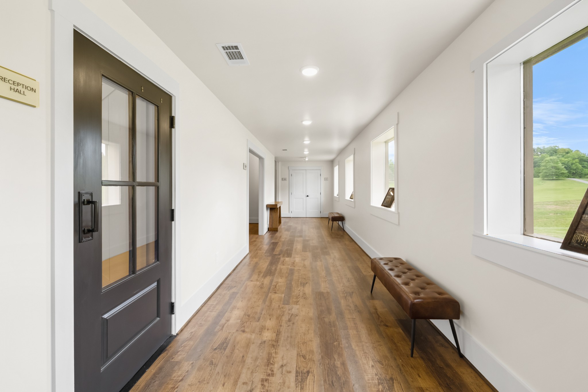 1249 Gulf Road Spencer, TN 38585 - Photo 64 of 98 a view of a hallway with wooden floor and staircase