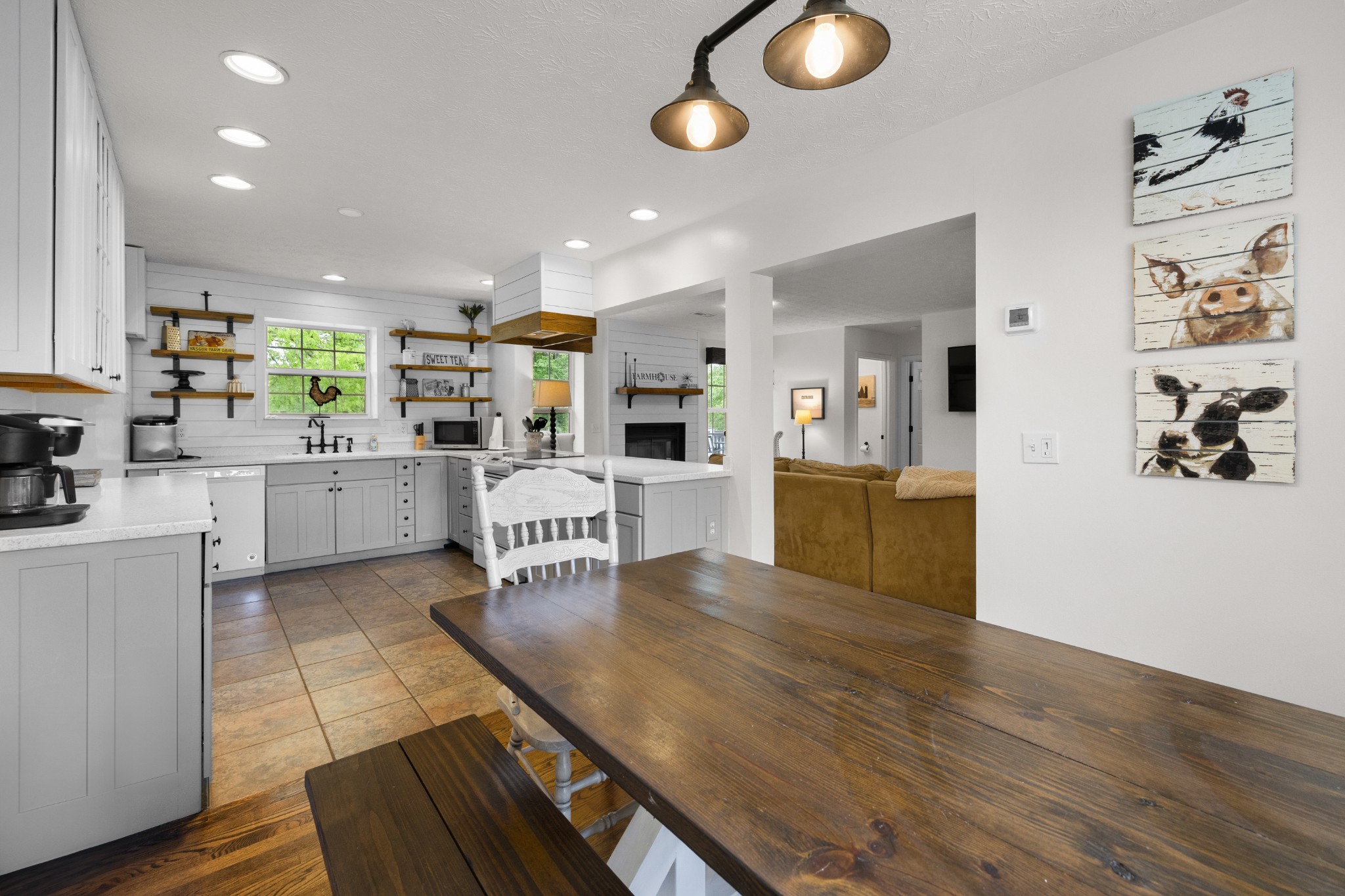 1249 Gulf Road Spencer, TN 38585 - Photo 86 of 98 a kitchen with stainless steel appliances kitchen island granite countertop a table chairs and a refrigerator