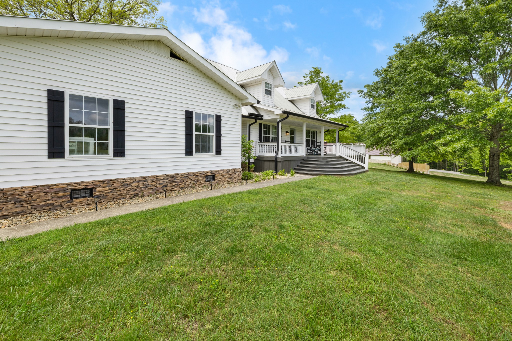1249 Gulf Road Spencer, TN 38585 - Photo 97 of 98 a front view of a house with a garden and yard