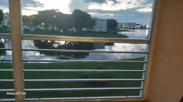 a view of a lake with a yard