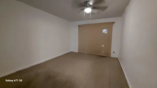 an empty room with a bathroom