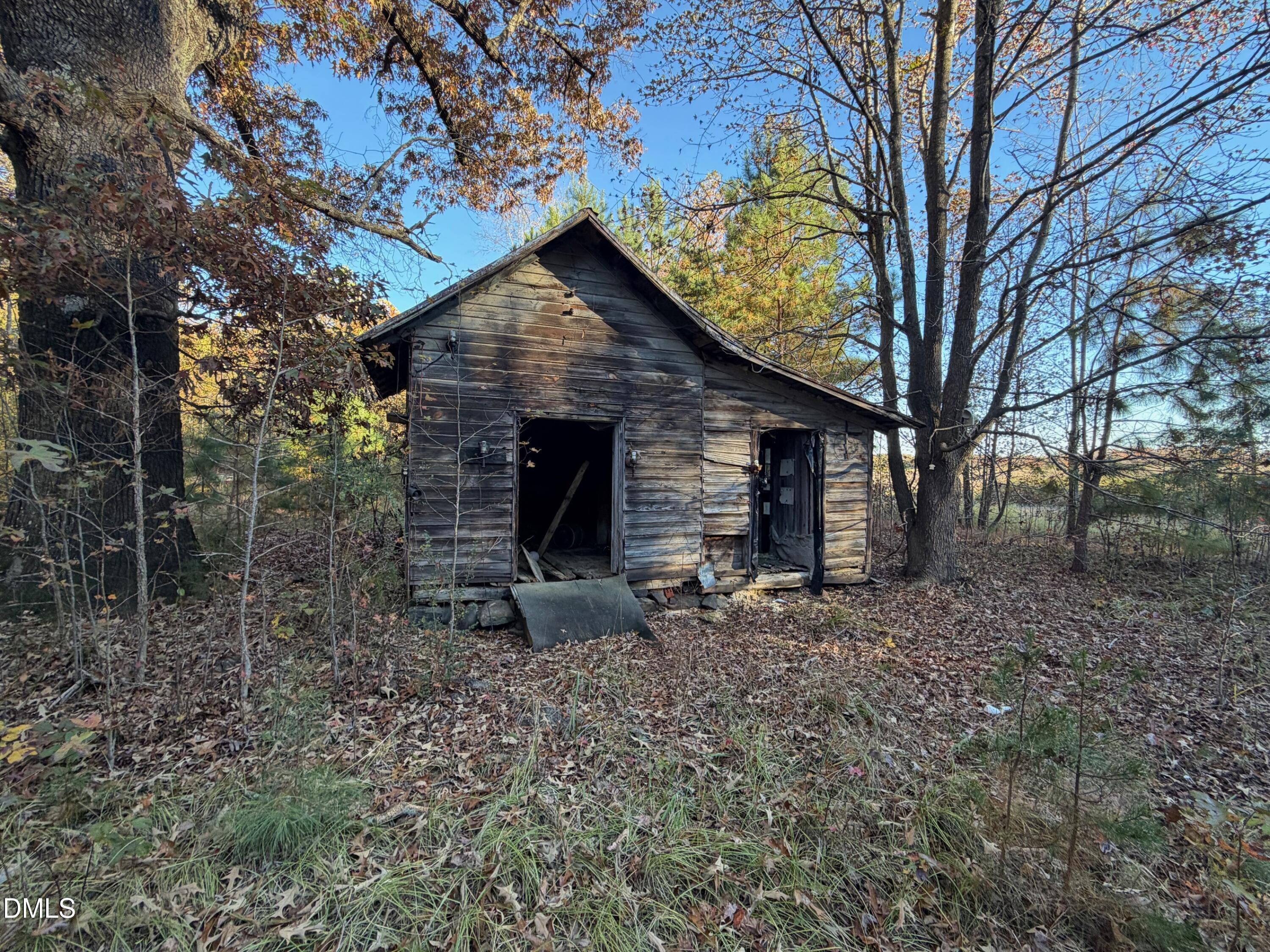1244 Jones Road Hurdle Mills, NC 27541 - Photo 9 of 17 a view of house with backyard space and garden