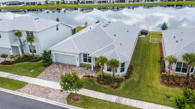 an aerial view of a house with a swimming pool