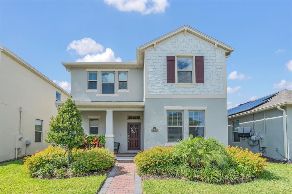 15789 Fountain Springs Road Winter Garden, FL 34787 - Photo 1 of 1 a front view of a house with a yard and garage