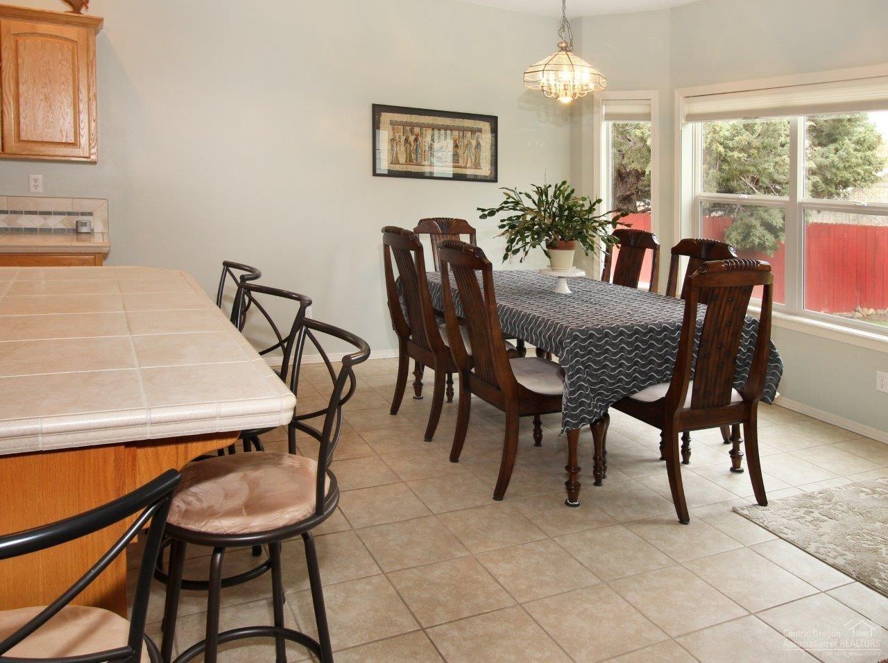 381 Southeast Soft Tail Loop Bend, OR 97702 - Photo 8 of 24 A large 6 chair table shows that this is