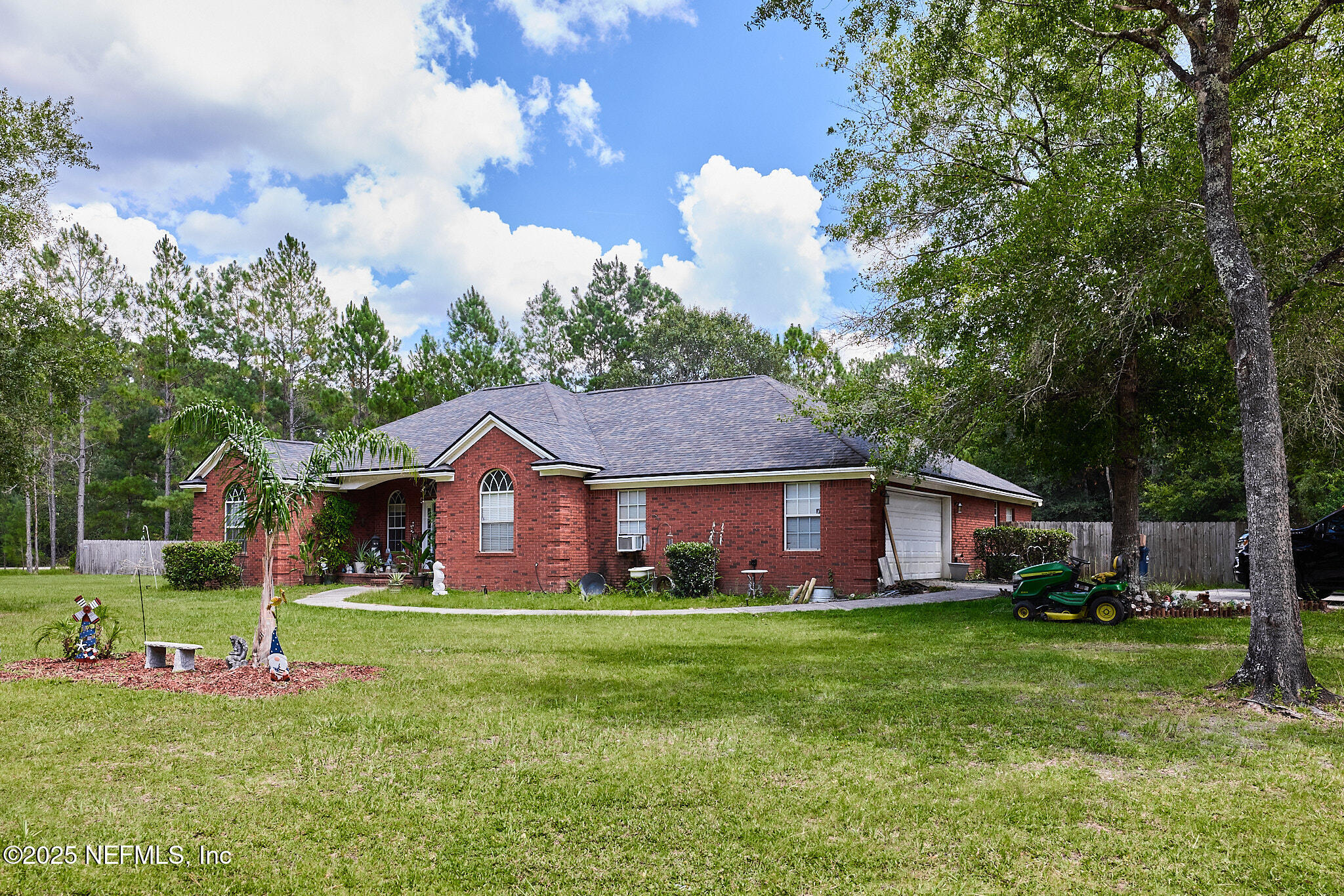 54262 Spring Lake Drive Callahan, FL 32011 - Photo 2 of 44 a front view of house with yard and green space