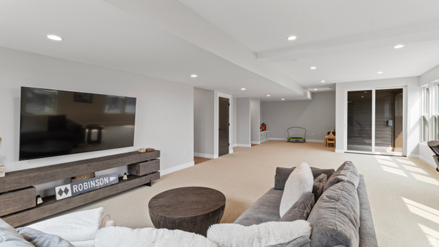 355 East Overlook Loop Hideout, UT 84036 - Photo 30 of 40 Spacious lower-level room featuring recessed lighting, light-toned carpeting, and light gray walls