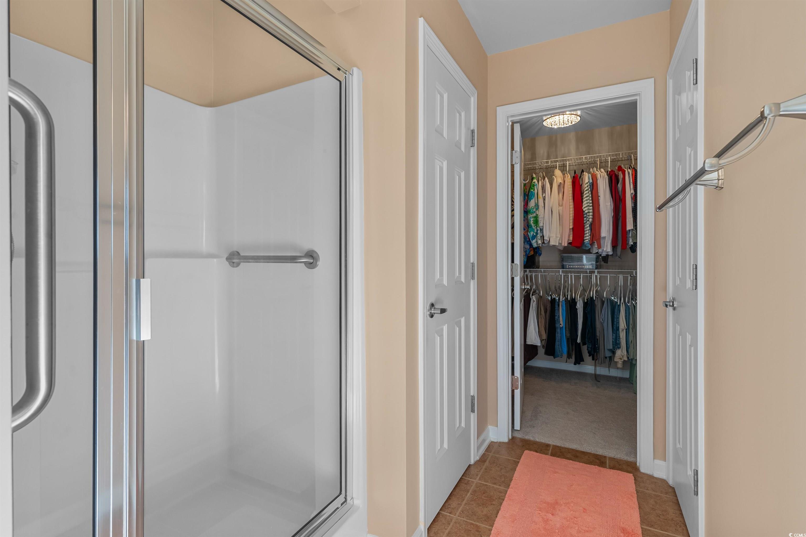 3505 Arrowhead Boulevard Myrtle Beach, SC 29579 - Photo 16 of 40 Full bath featuring a stall shower, light tile patterned floors, and a spacious closet