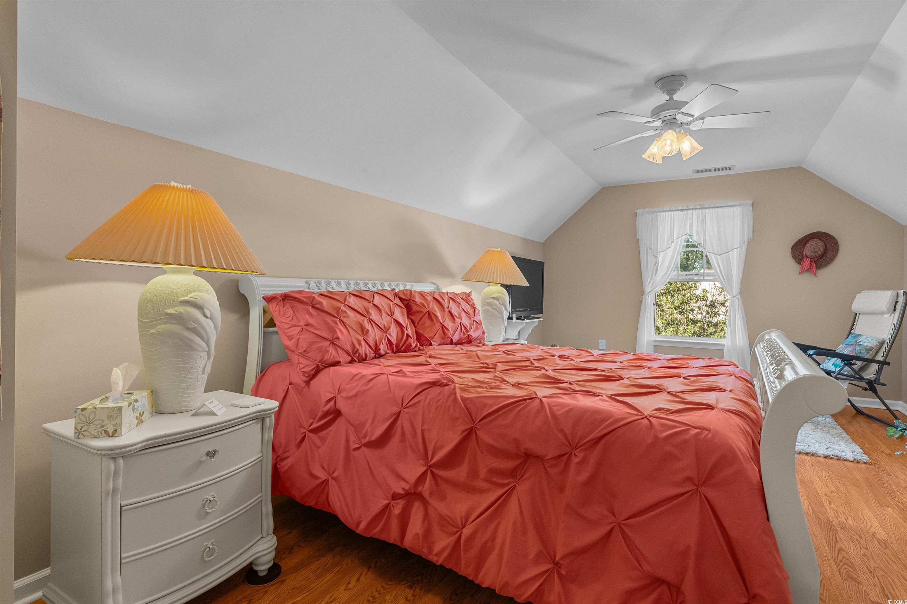 3505 Arrowhead Boulevard Myrtle Beach, SC 29579 - Photo 27 of 40 Bedroom with wood finished floors, lofted ceiling, and a ceiling fan