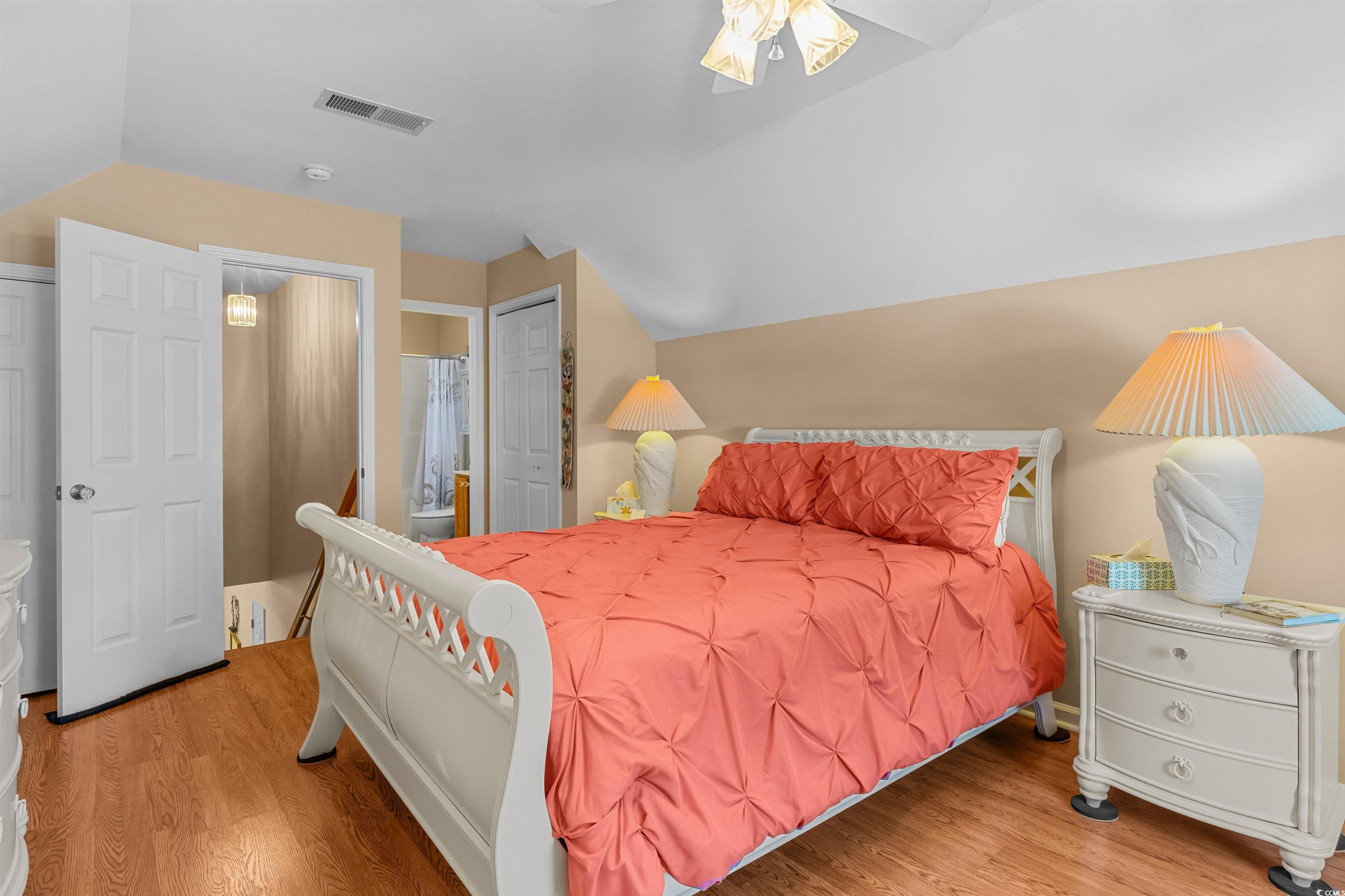 3505 Arrowhead Boulevard Myrtle Beach, SC 29579 - Photo 28 of 40 Bedroom with a closet, vaulted ceiling, light wood-style floors, and ceiling fan