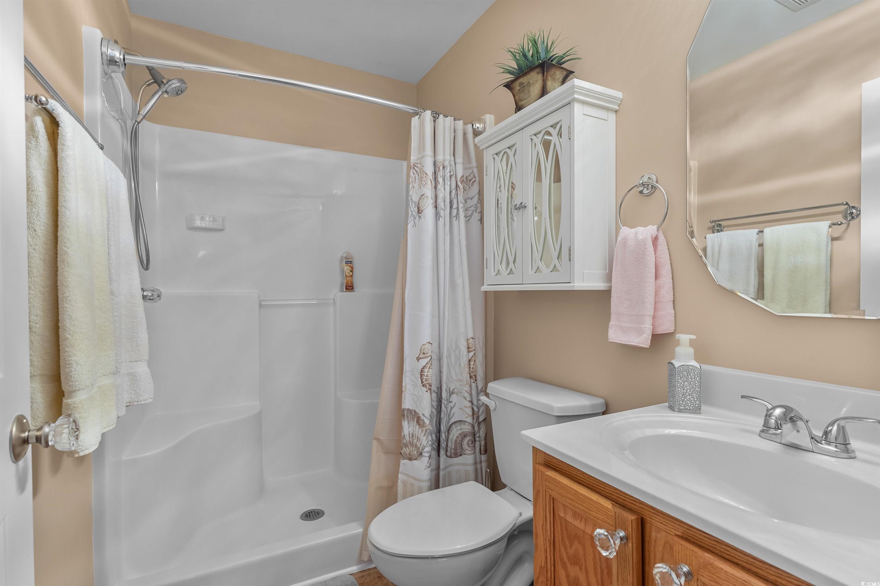 3505 Arrowhead Boulevard Myrtle Beach, SC 29579 - Photo 29 of 40 Bathroom with a stall shower and vanity
