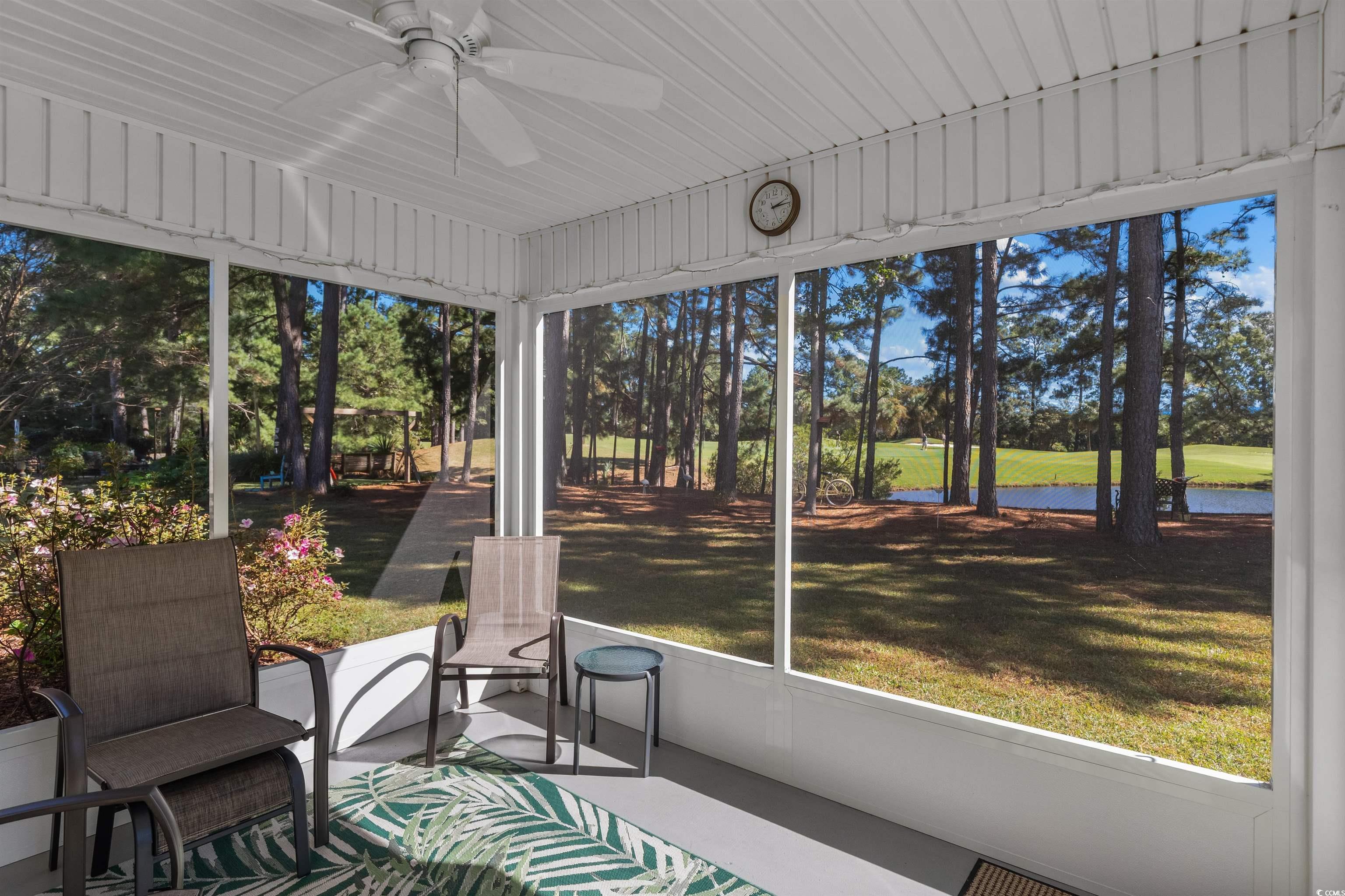 3505 Arrowhead Boulevard Myrtle Beach, SC 29579 - Photo 33 of 40 Sunroom / solarium featuring a ceiling fan, healthy amount of natural light, and a water view