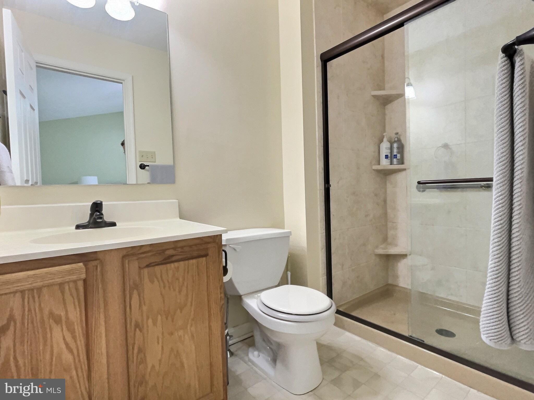 42 Highland Circle Newark, DE 19713 - Photo 11 of 19 a bathroom with a sink a toilet and shower