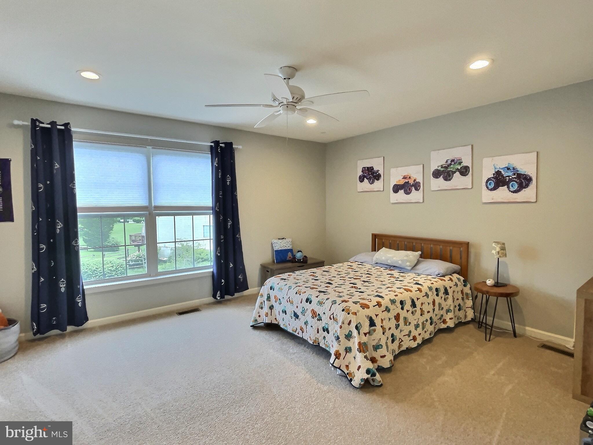 42 Highland Circle Newark, DE 19713 - Photo 12 of 19 a bedroom with a bed and a large window