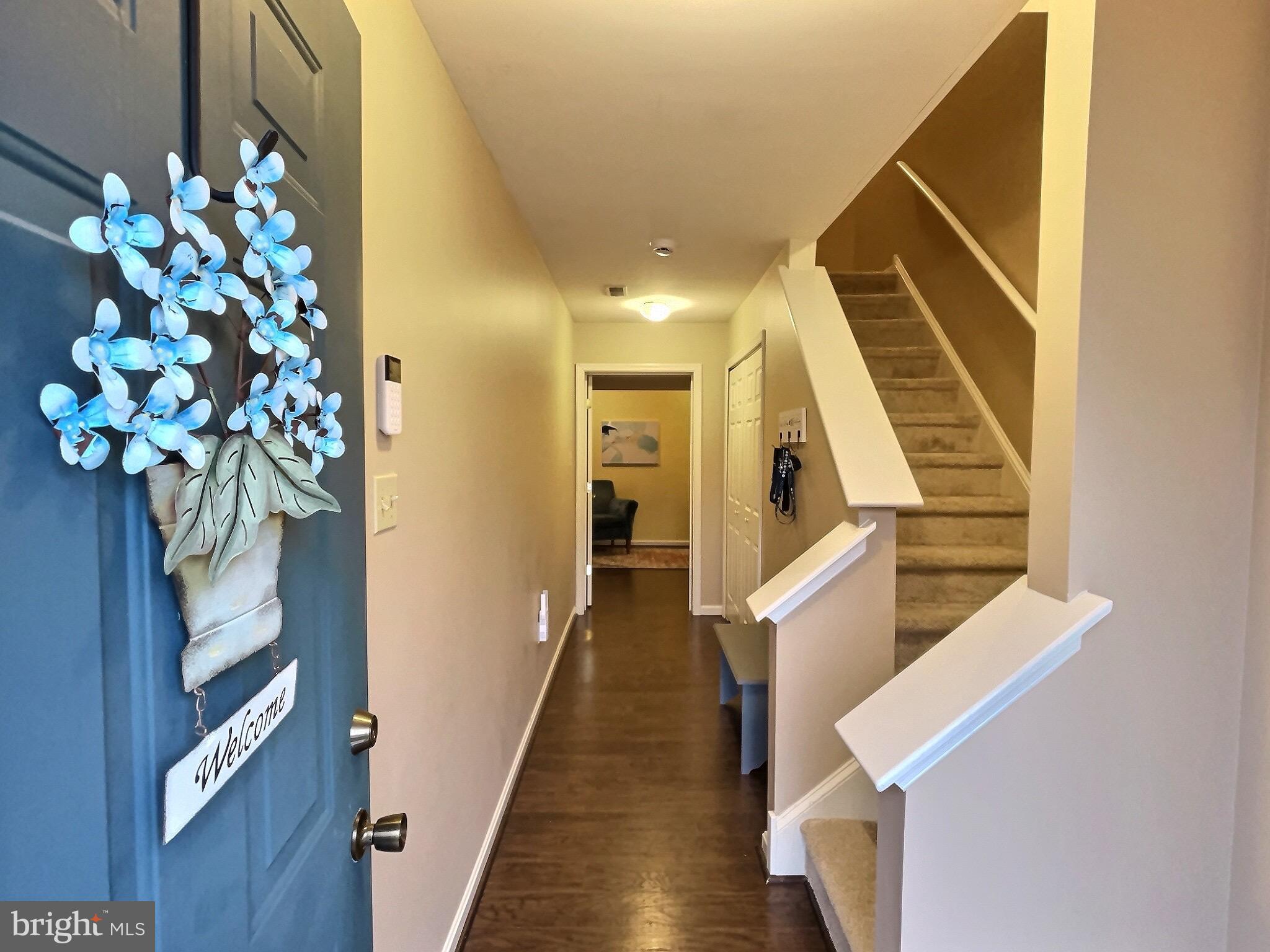 42 Highland Circle Newark, DE 19713 - Photo 2 of 19 a view of entryway and hall with wooden floor
