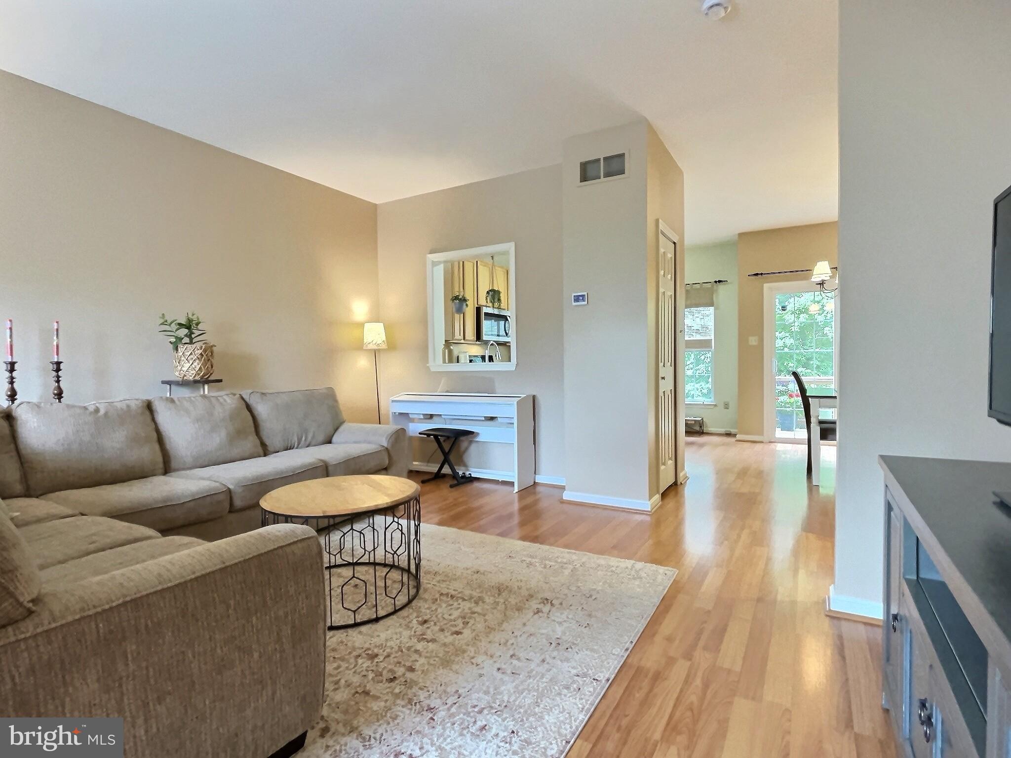 42 Highland Circle Newark, DE 19713 - Photo 3 of 19 a living room with furniture and a wooden floor