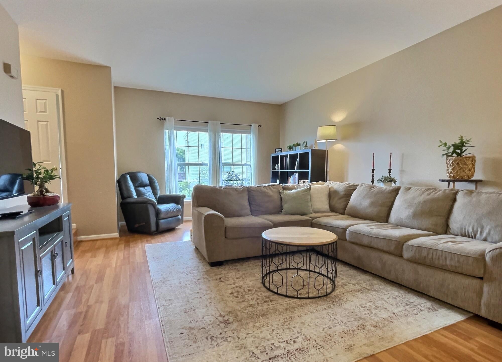 42 Highland Circle Newark, DE 19713 - Photo 4 of 19 a living room with furniture a couch and a flat screen tv