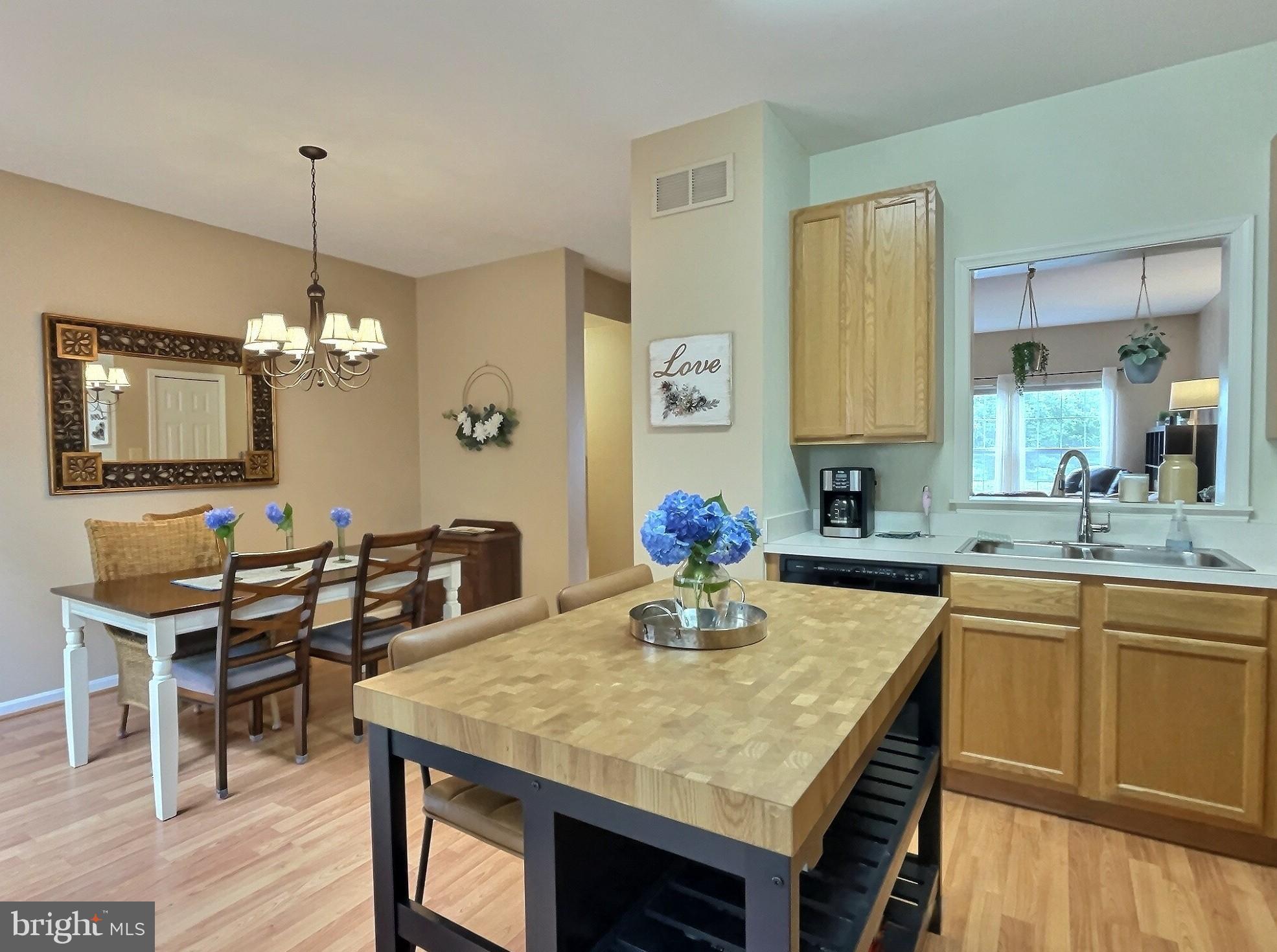 42 Highland Circle Newark, DE 19713 - Photo 6 of 19 a dining table with chairs and kitchen view