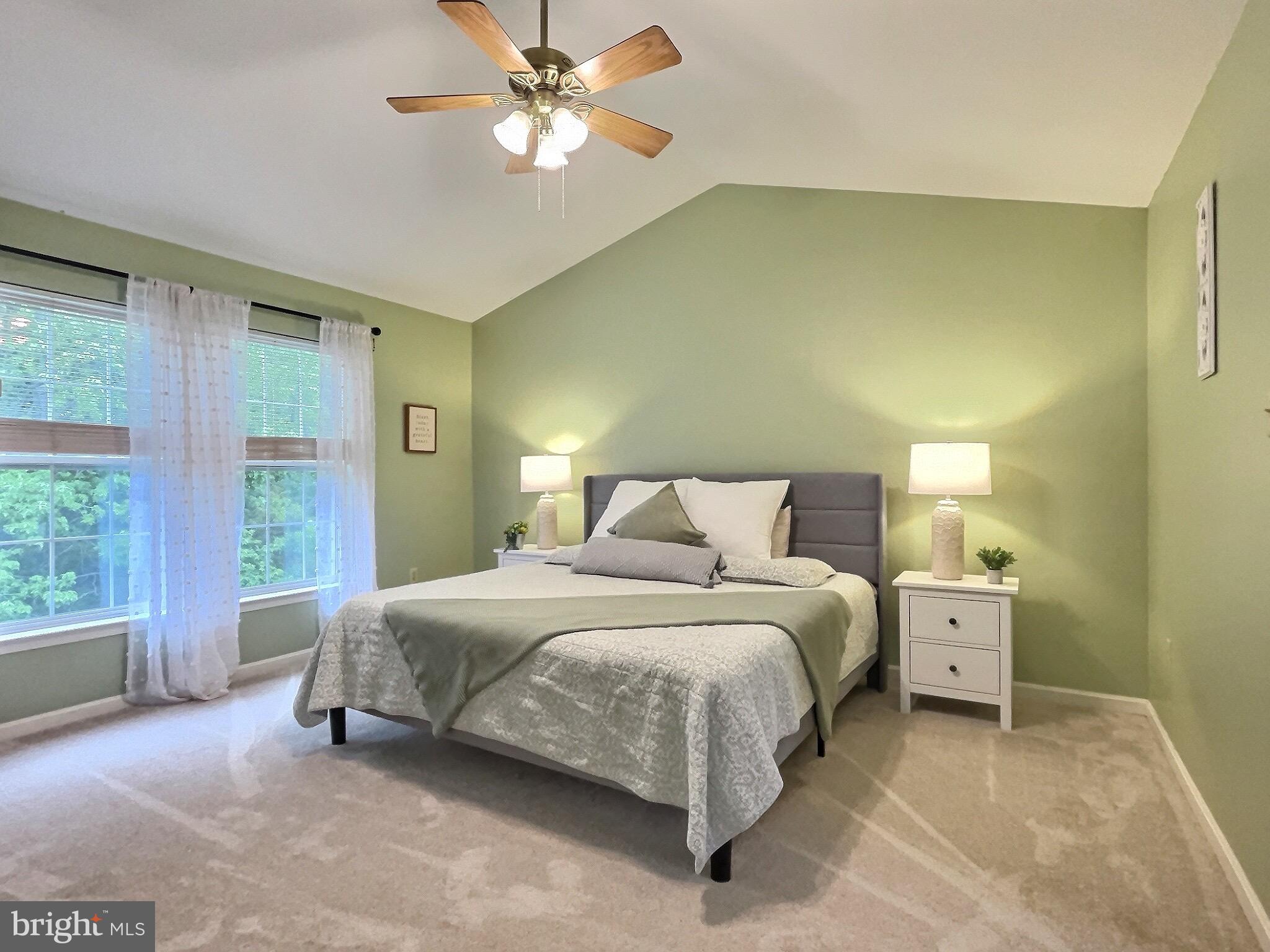 42 Highland Circle Newark, DE 19713 - Photo 8 of 19 a bedroom with a large bed and a chandelier