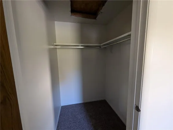 a view of an empty walk in closet