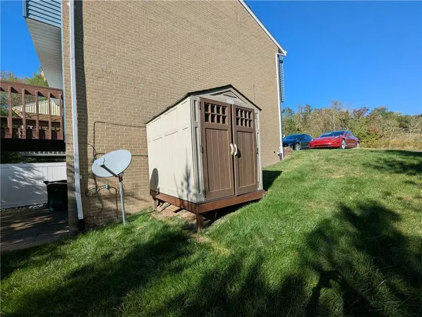 a view of a bench in front of a house