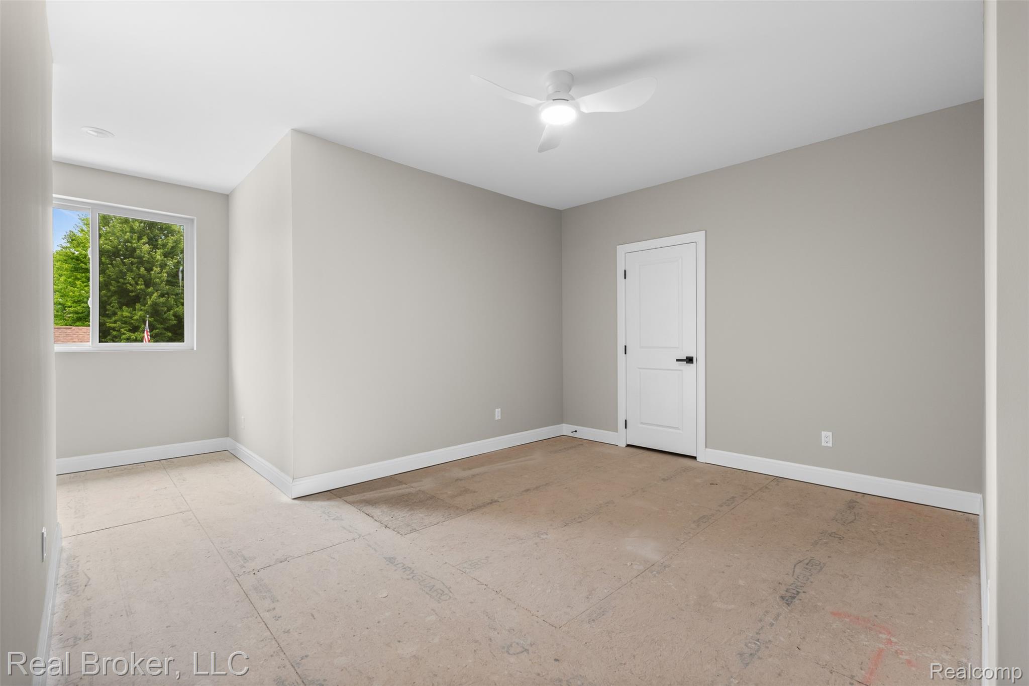 12114 22 Mile Road Utica, MI 48315 - Photo 50 of 70 Recessed lighting, ceiling fan light fixture, white trim, interior door with black hardware, window with natural lighting