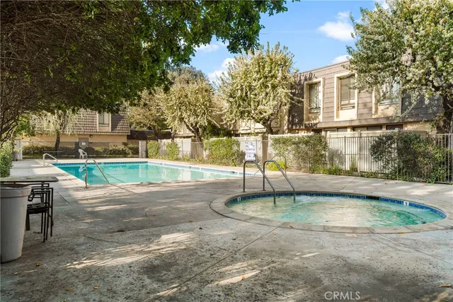 a view of a swimming pool with a patio