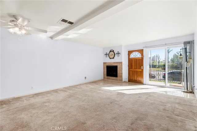 a view of empty room with floor to ceiling window