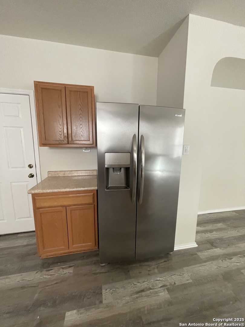 11111 Denae Drive Live Oak, TX 78233 - Photo 15 of 43 a kitchen with stainless steel appliances granite countertop a refrigerator and a sink