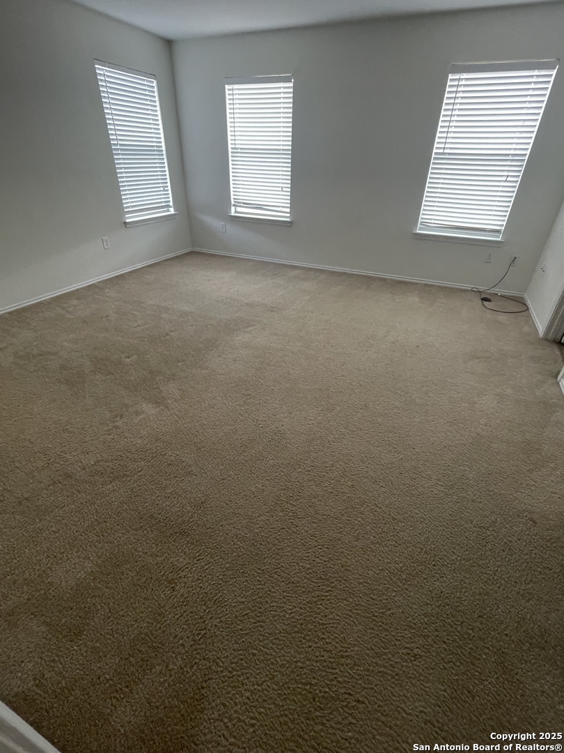 11111 Denae Drive Live Oak, TX 78233 - Photo 18 of 43 an empty room with windows