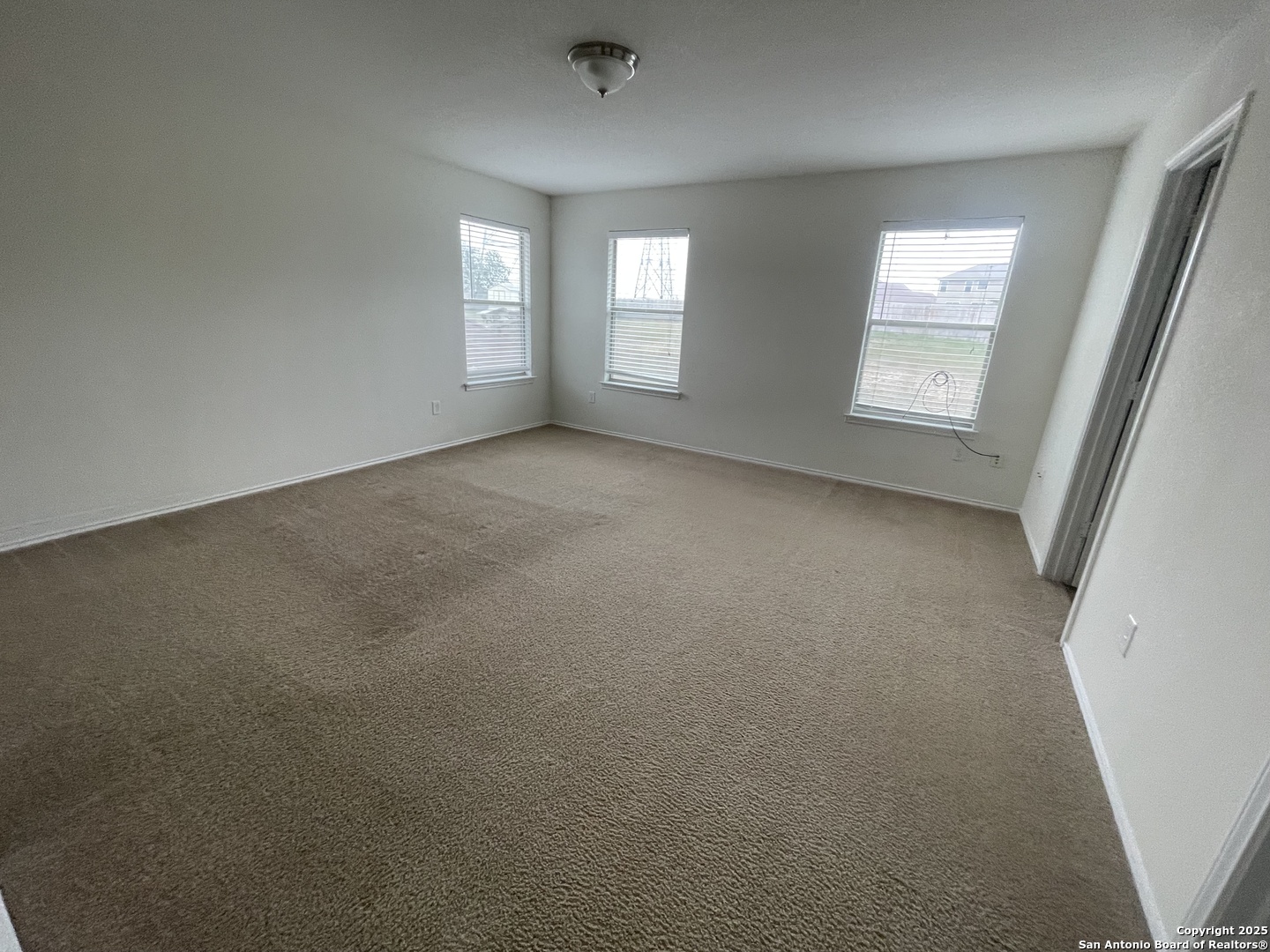 11111 Denae Drive Live Oak, TX 78233 - Photo 19 of 43 an empty room with windows and door