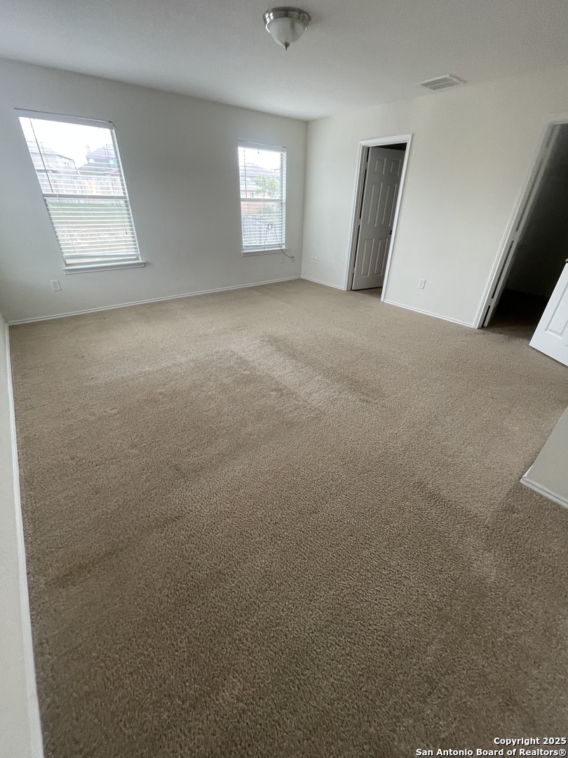11111 Denae Drive Live Oak, TX 78233 - Photo 20 of 43 an empty room with windows