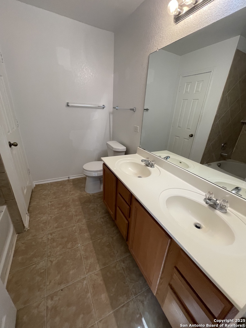 11111 Denae Drive Live Oak, TX 78233 - Photo 22 of 43 a bathroom with a sink and a mirror