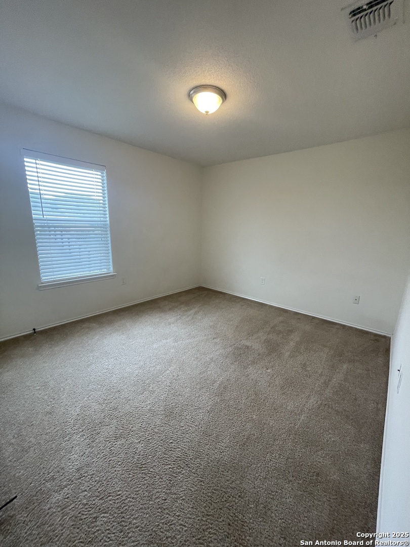 11111 Denae Drive Live Oak, TX 78233 - Photo 25 of 43 an empty room with a empty space and windows