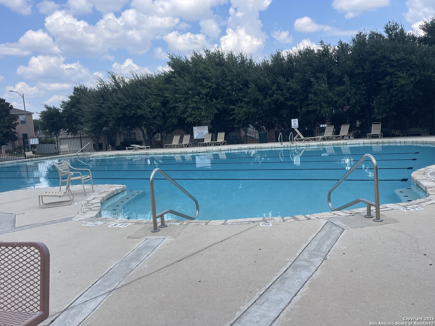 11111 Denae Drive Live Oak, TX 78233 - Photo 38 of 43 a view of a swimming pool with a yard