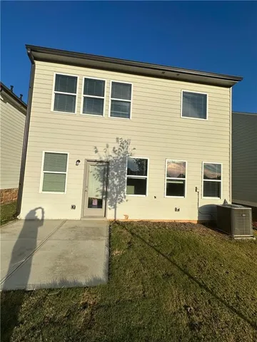 a front view of a house with yard