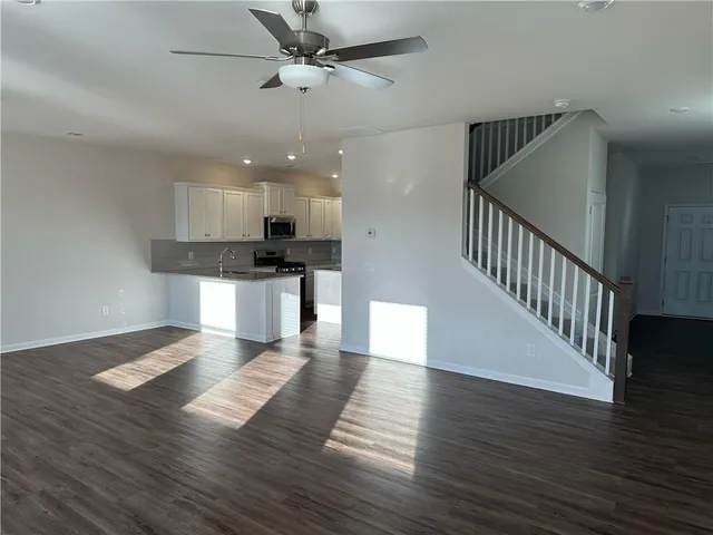 a view of kitchen with sink microwave and stove