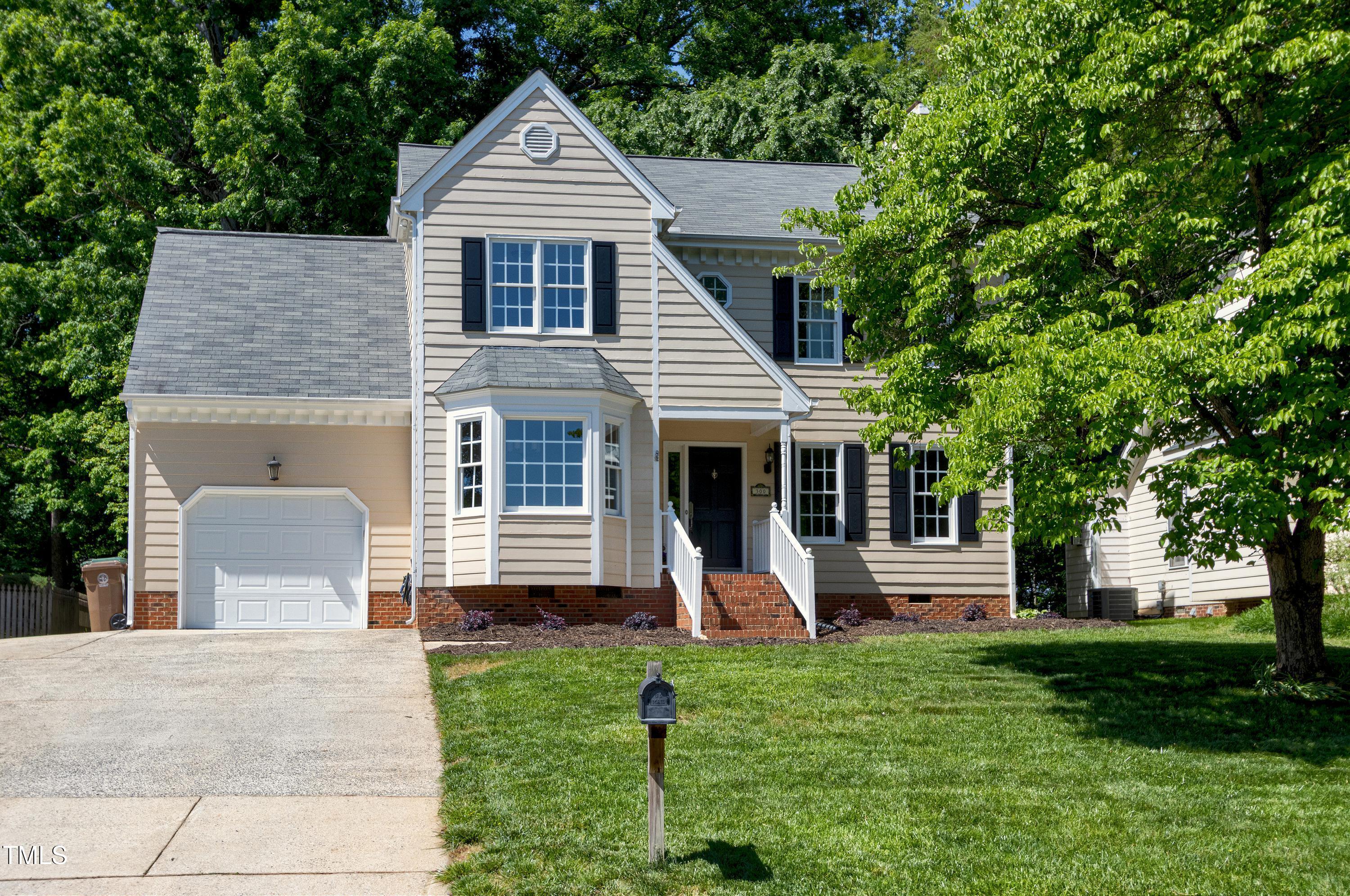 300 Silvercliff Trail Cary, NC 27513 - Photo 1 of 27 a front view of a house with a yard