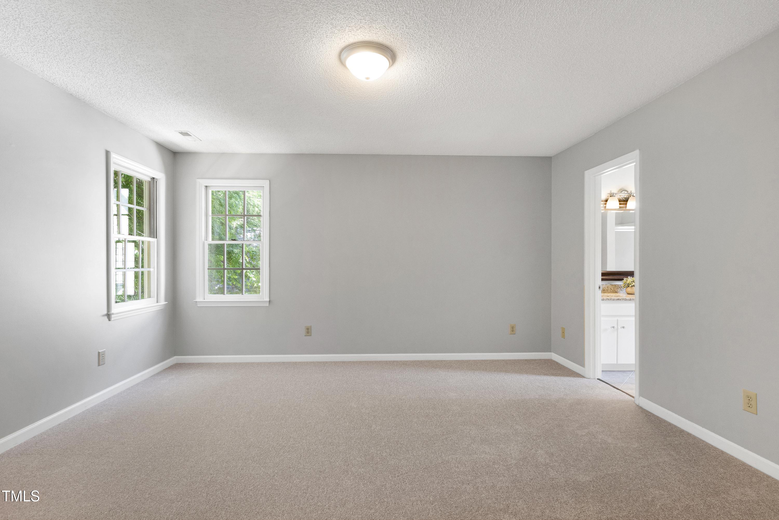 300 Silvercliff Trail Cary, NC 27513 - Photo 11 of 27 an empty room with windows and closet