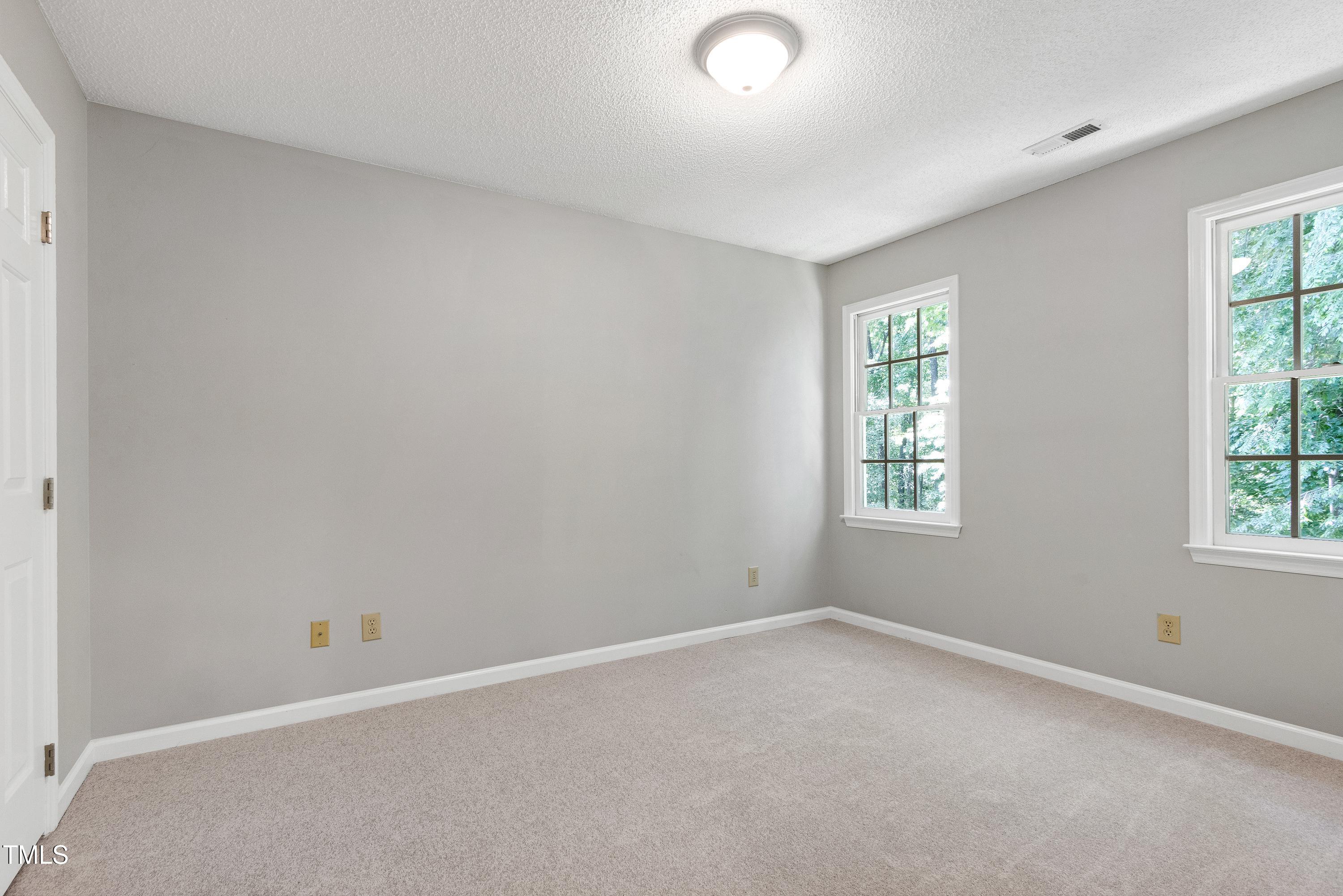 300 Silvercliff Trail Cary, NC 27513 - Photo 16 of 27 an empty room with windows