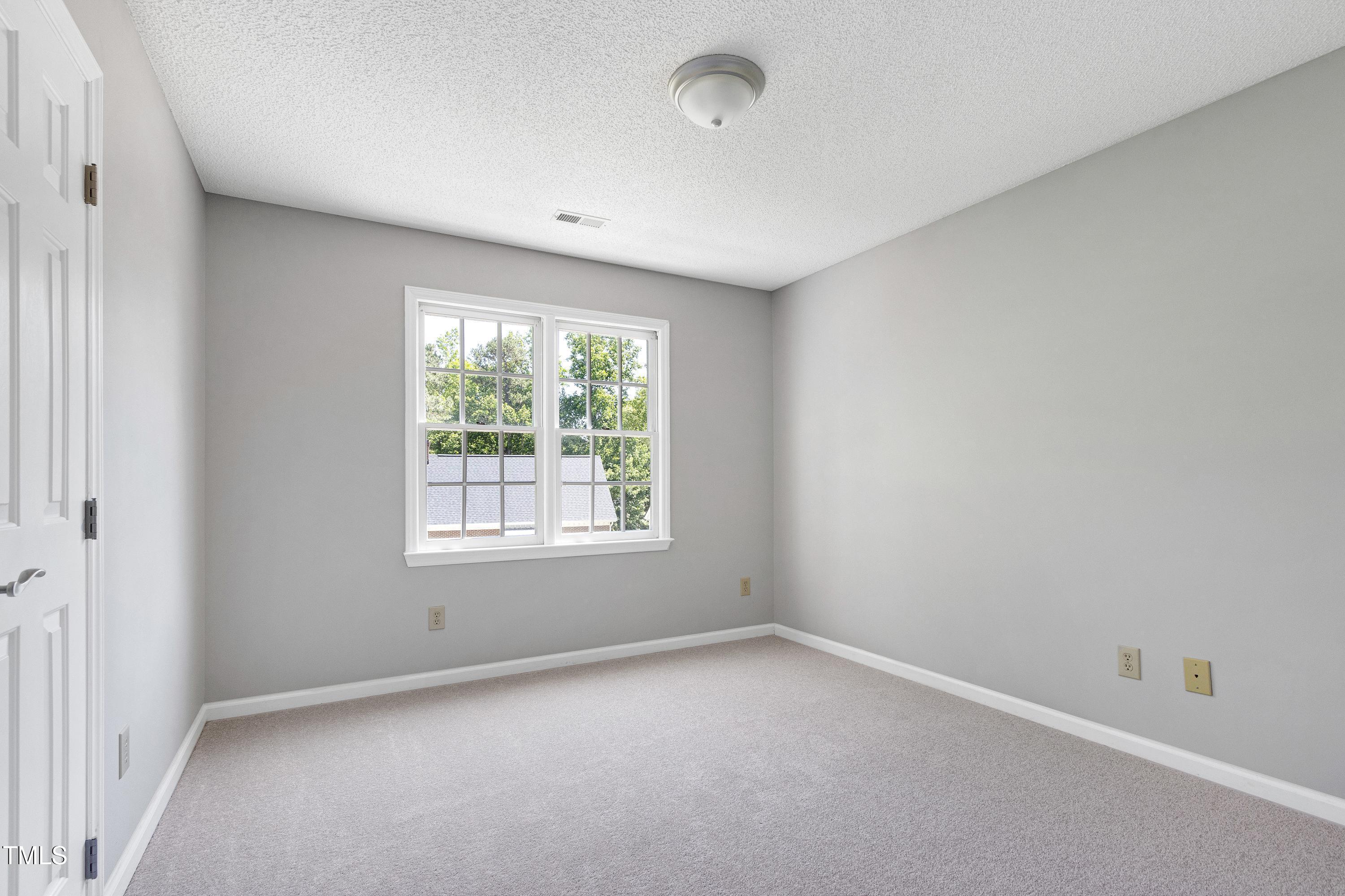 300 Silvercliff Trail Cary, NC 27513 - Photo 17 of 27 an empty room with a window