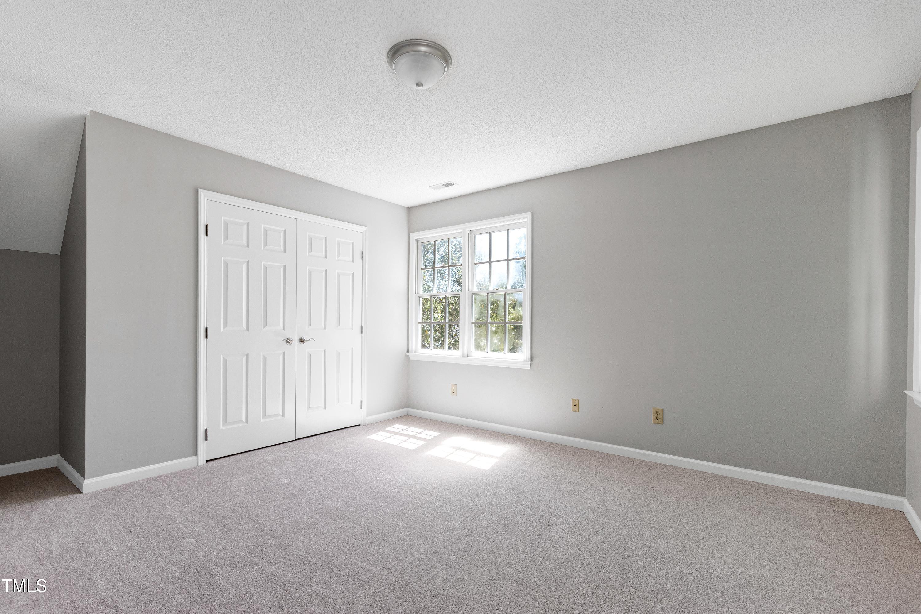 300 Silvercliff Trail Cary, NC 27513 - Photo 20 of 27 wooden floor in an empty room with a window
