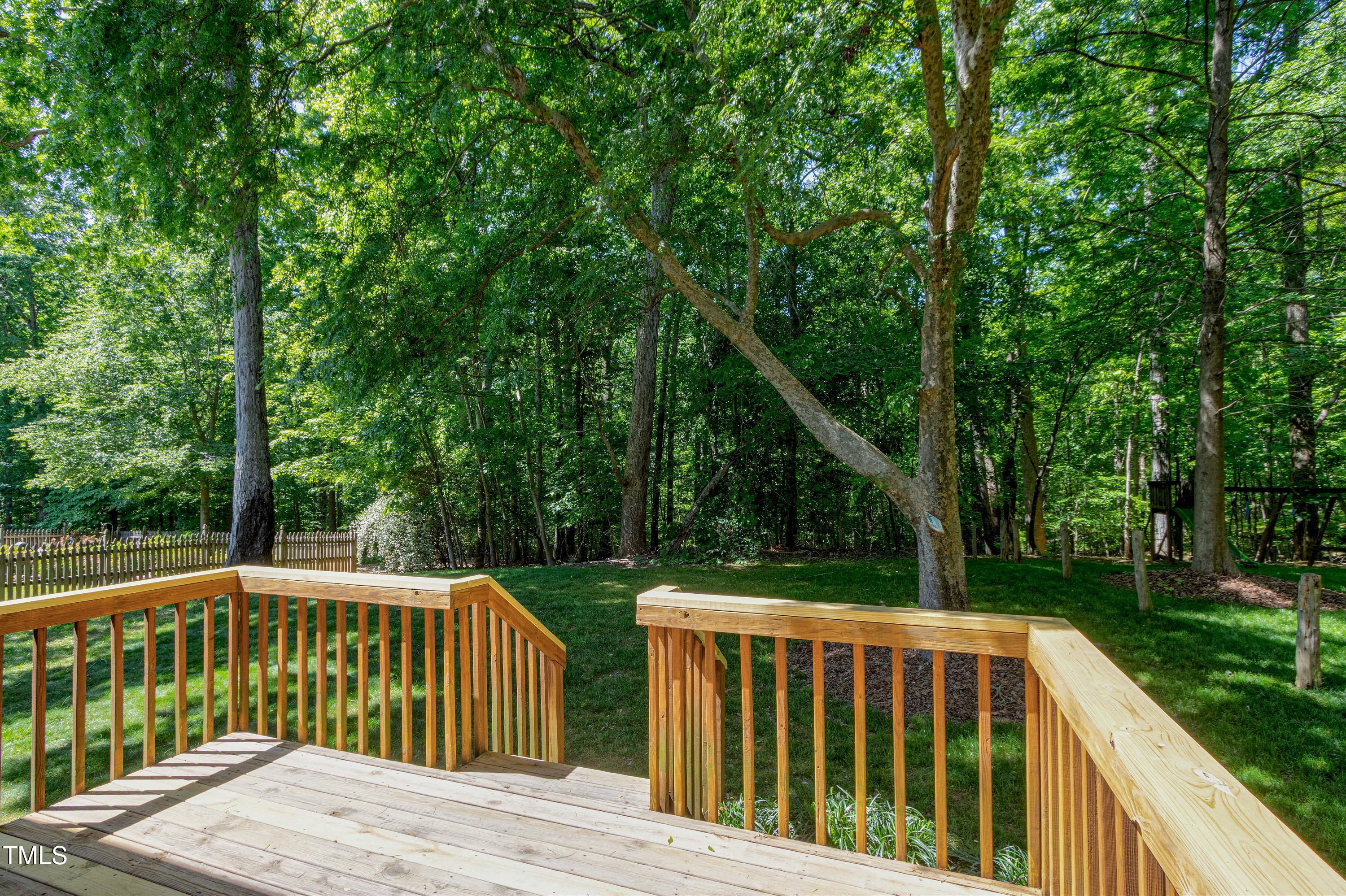 300 Silvercliff Trail Cary, NC 27513 - Photo 24 of 27 a view of backyard with deck and garden