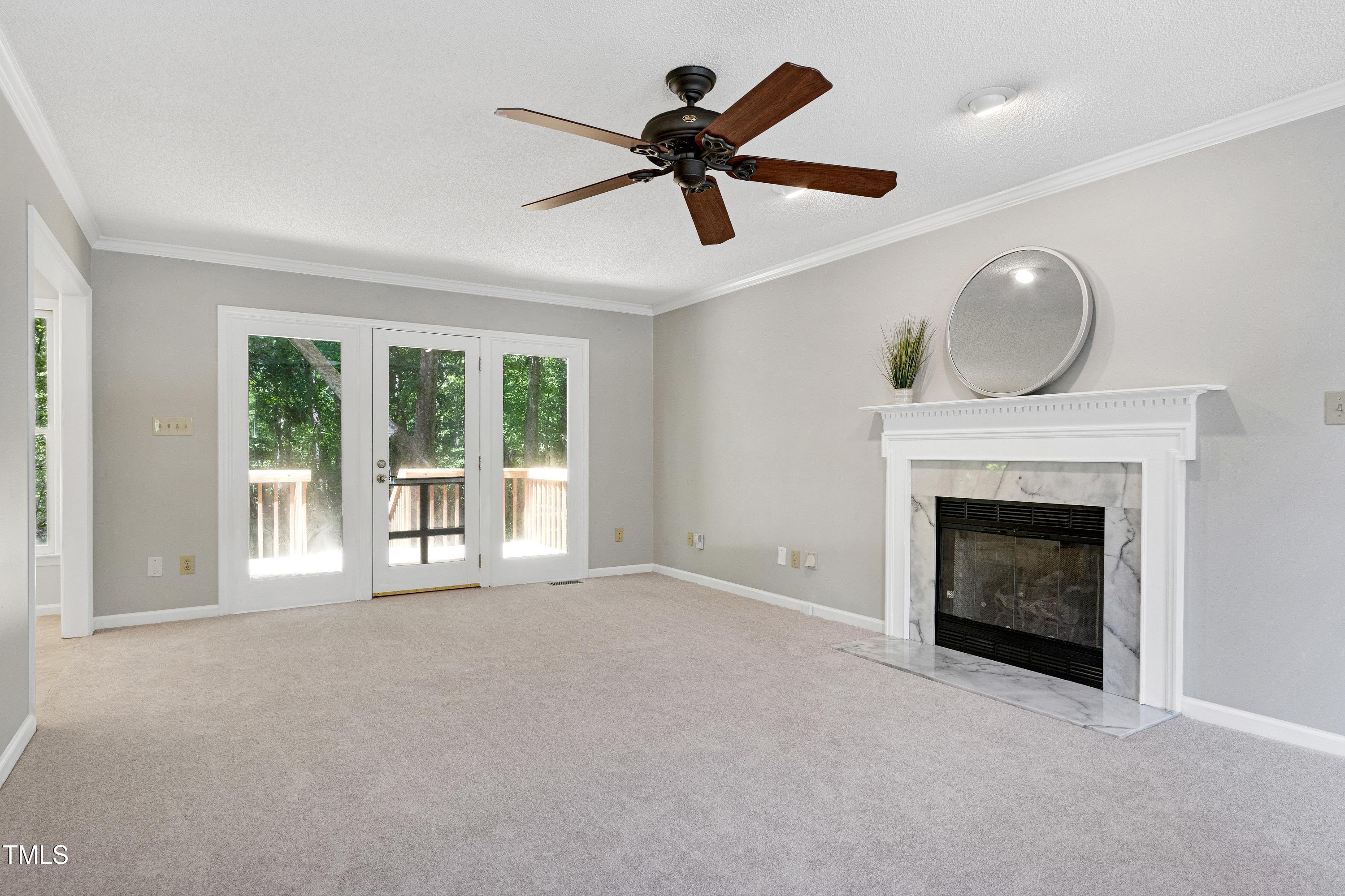 300 Silvercliff Trail Cary, NC 27513 - Photo 3 of 27 a living room with furniture and a fireplace