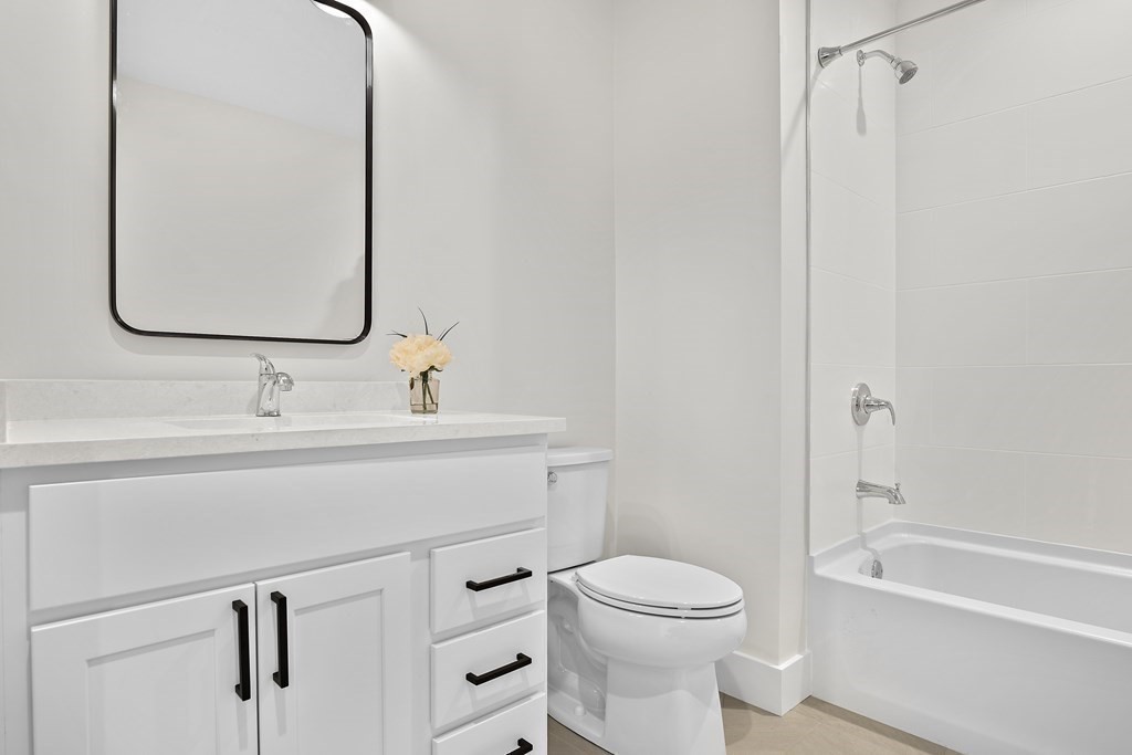 25 Salisbury Hill Boulevard, Unit 64 Worcester, MA 01609 - Photo 23 of 41 a bathroom with a sink a toilet and shower