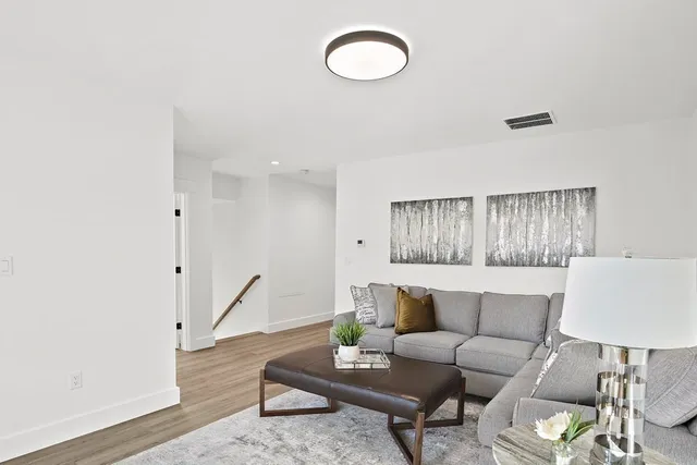 a kitchen with white cabinets and appliances