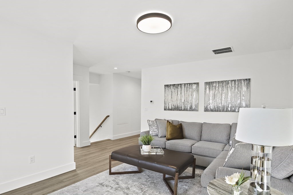 25 Salisbury Hill Boulevard, Unit 64 Worcester, MA 01609 - Photo 27 of 41 a living room with furniture and a window
