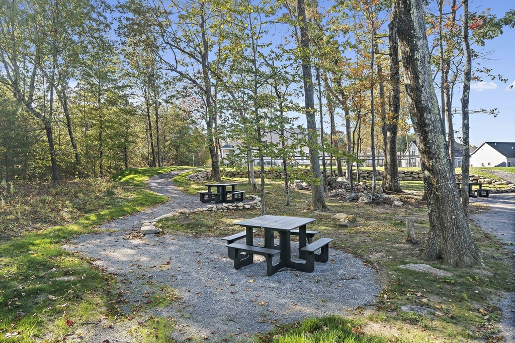 25 Salisbury Hill Boulevard, Unit 64 Worcester, MA 01609 - Photo 38 of 41 a view of a backyard with sitting area